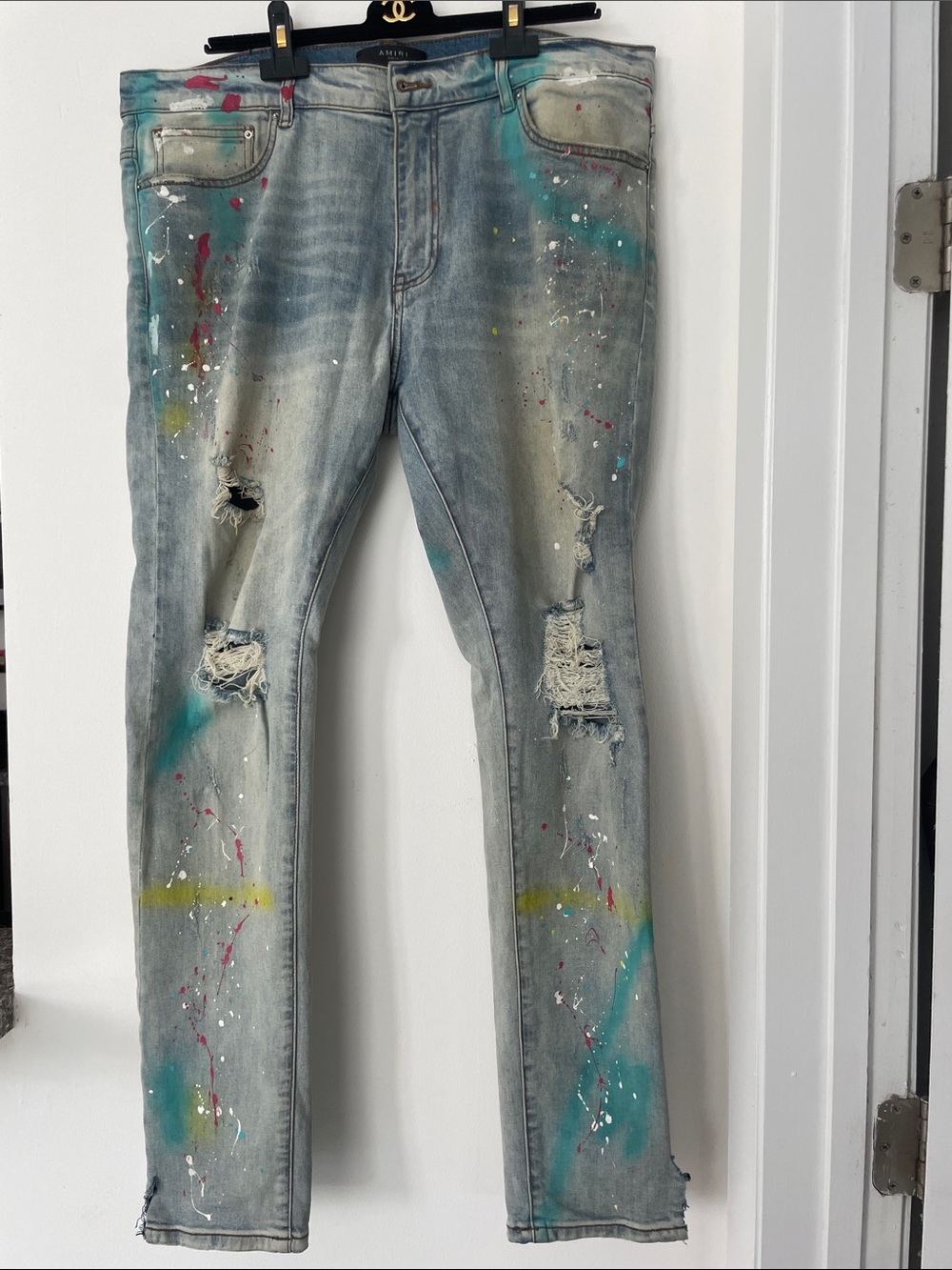 AMIRI Light Wash Skinny Jeans with Paint-Splatter Accents